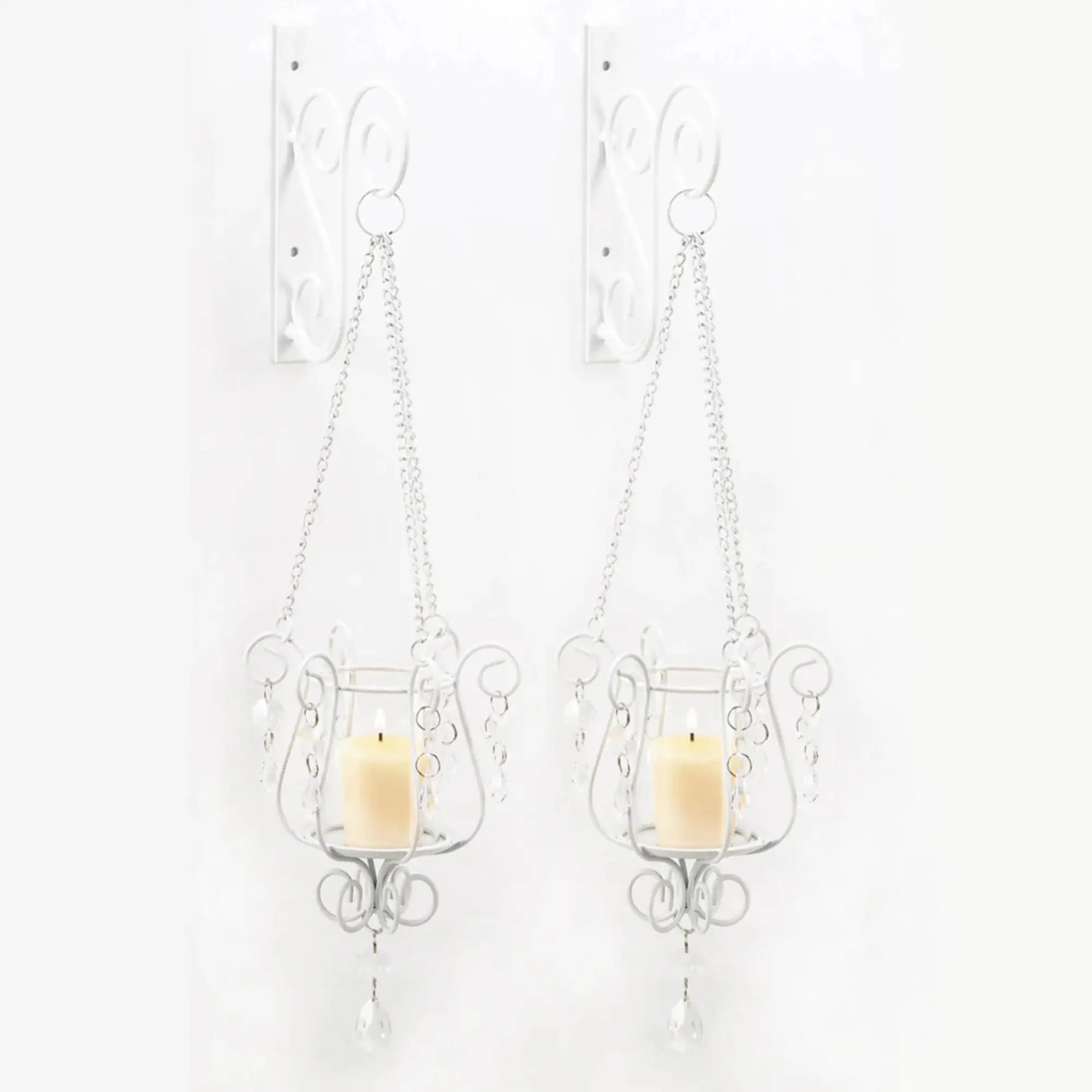 Two decorative wall sconces with candles on a white background