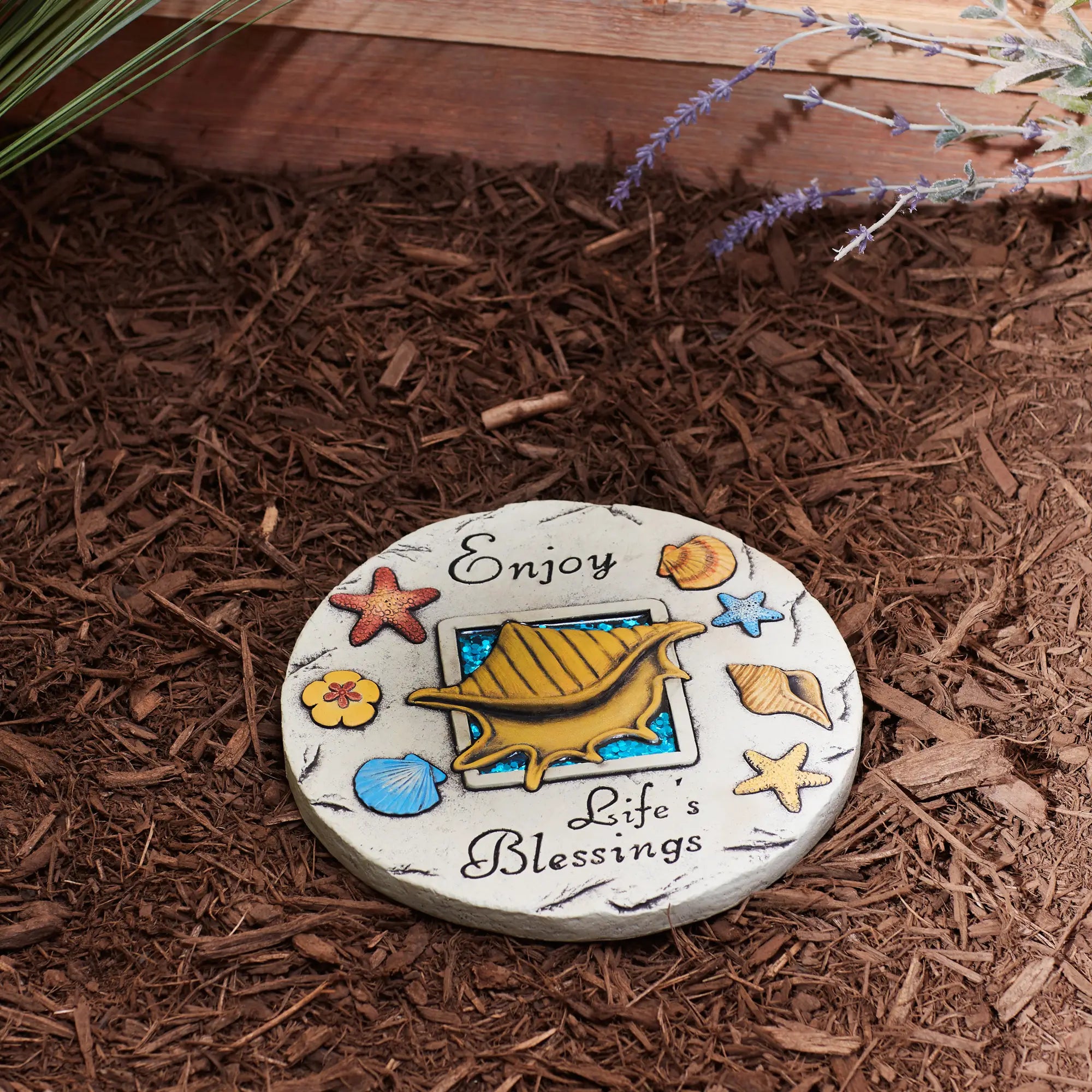 Enjoy Life’s Blessings garden stepping stone with shell and beach design on mulch