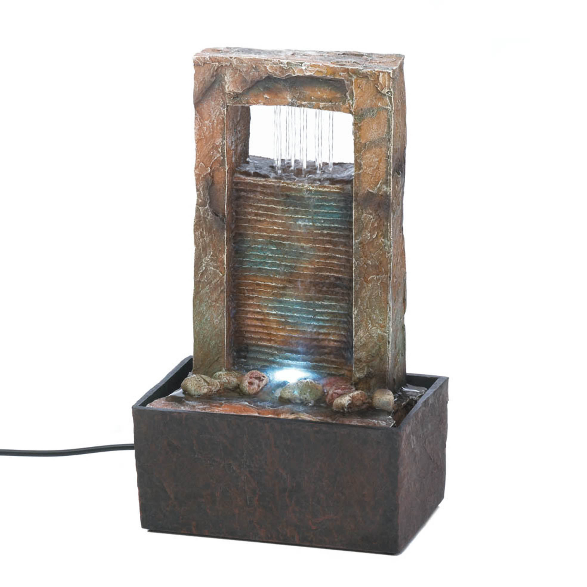 Small indoor water fountain with stone-like design on a white background