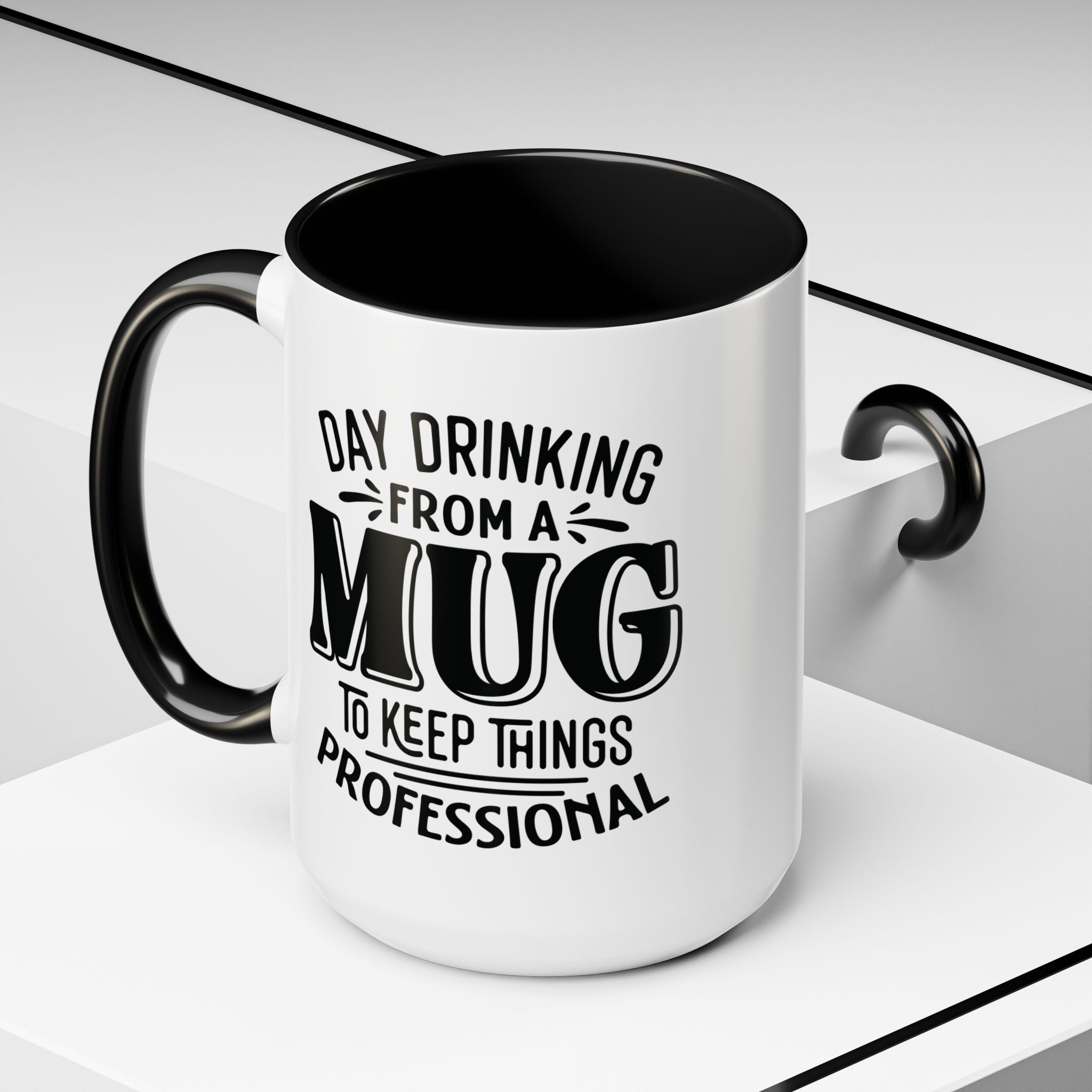A white ceramic mug with a black interior, black handle, and black printed text reading 'DAY DRINKING FROM A MUG TO KEEP THINGS PROFESSIONAL', shown on a clean white geometric background.
