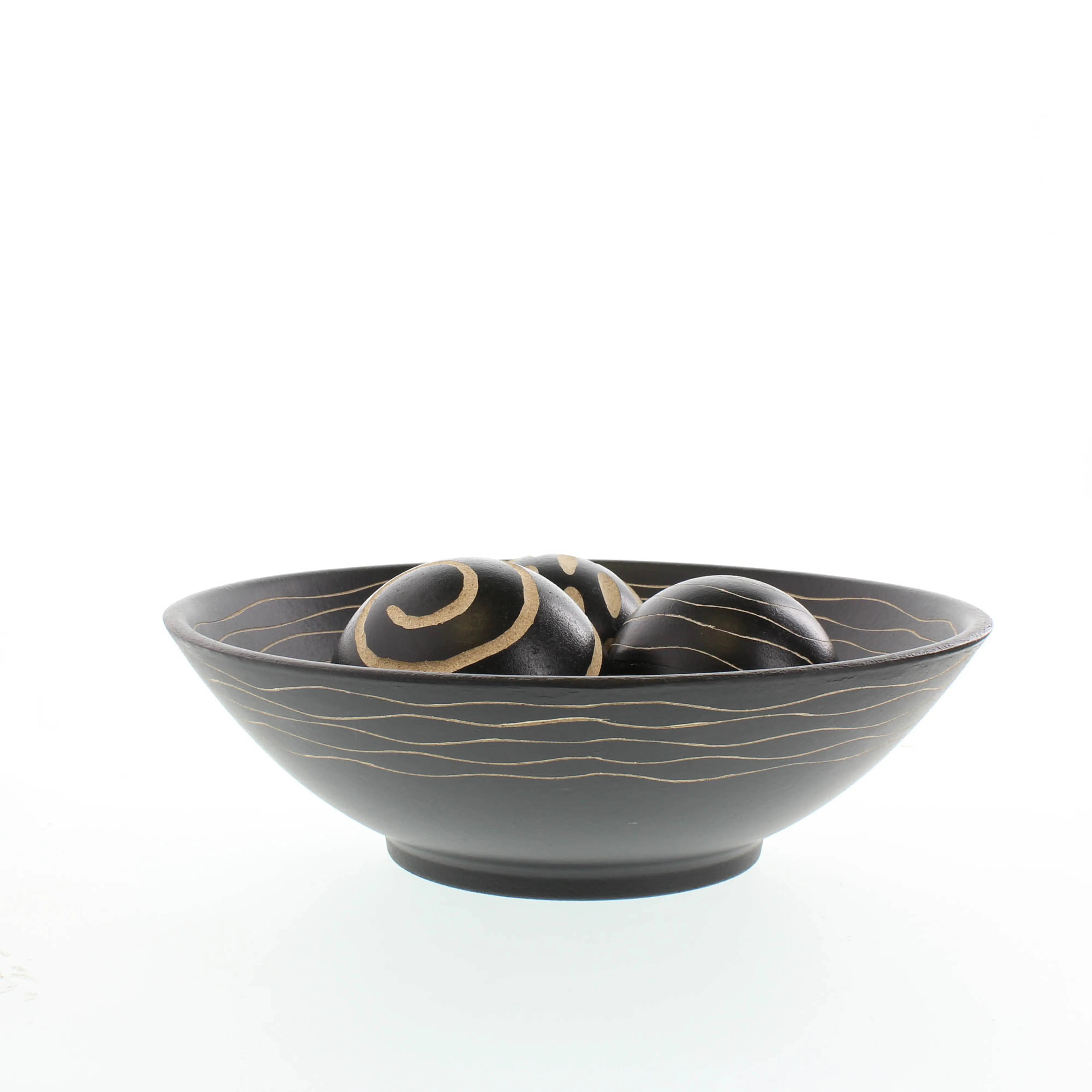 Black decorative bowl centerpiece with three textured accent balls