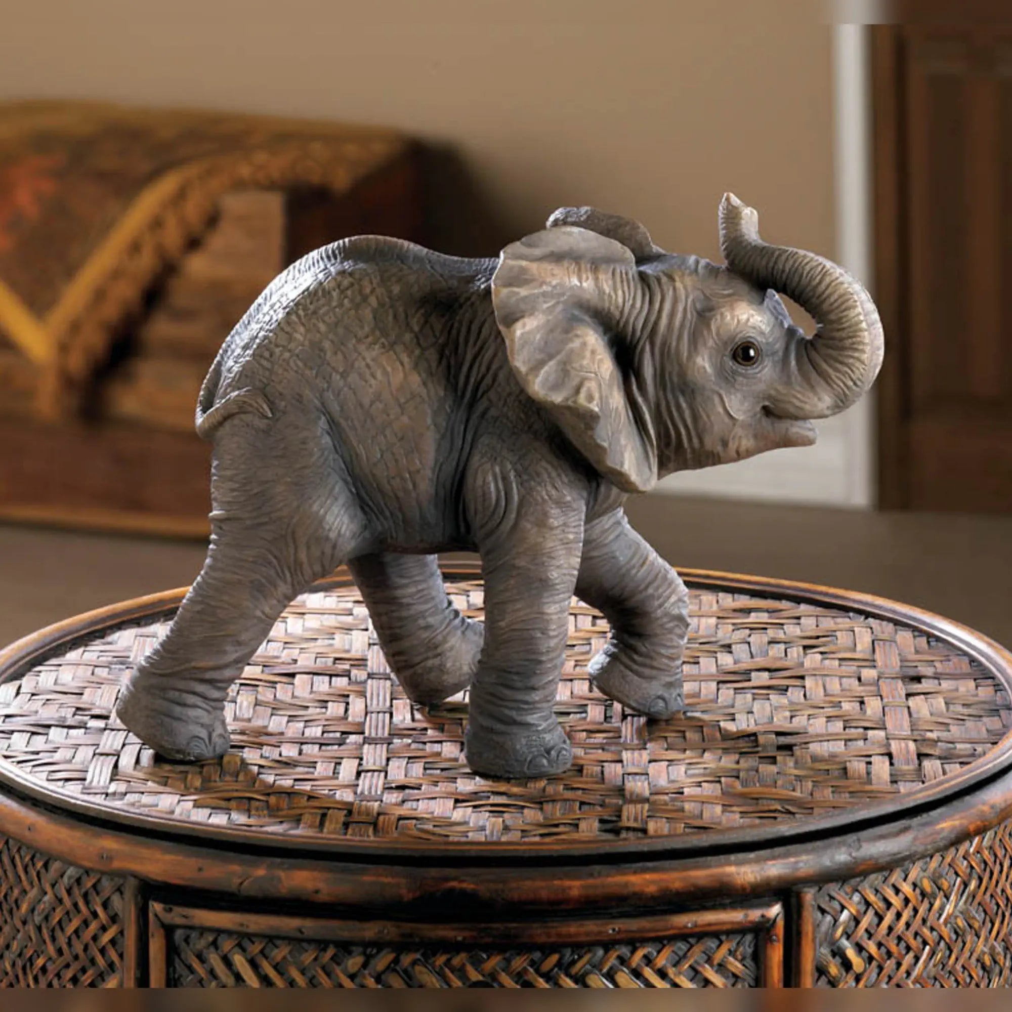 Happy elephant figurine on a woven table
