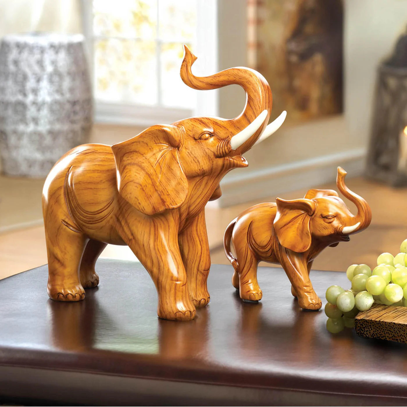 Wooden elephant figurines on a table in decorative setting