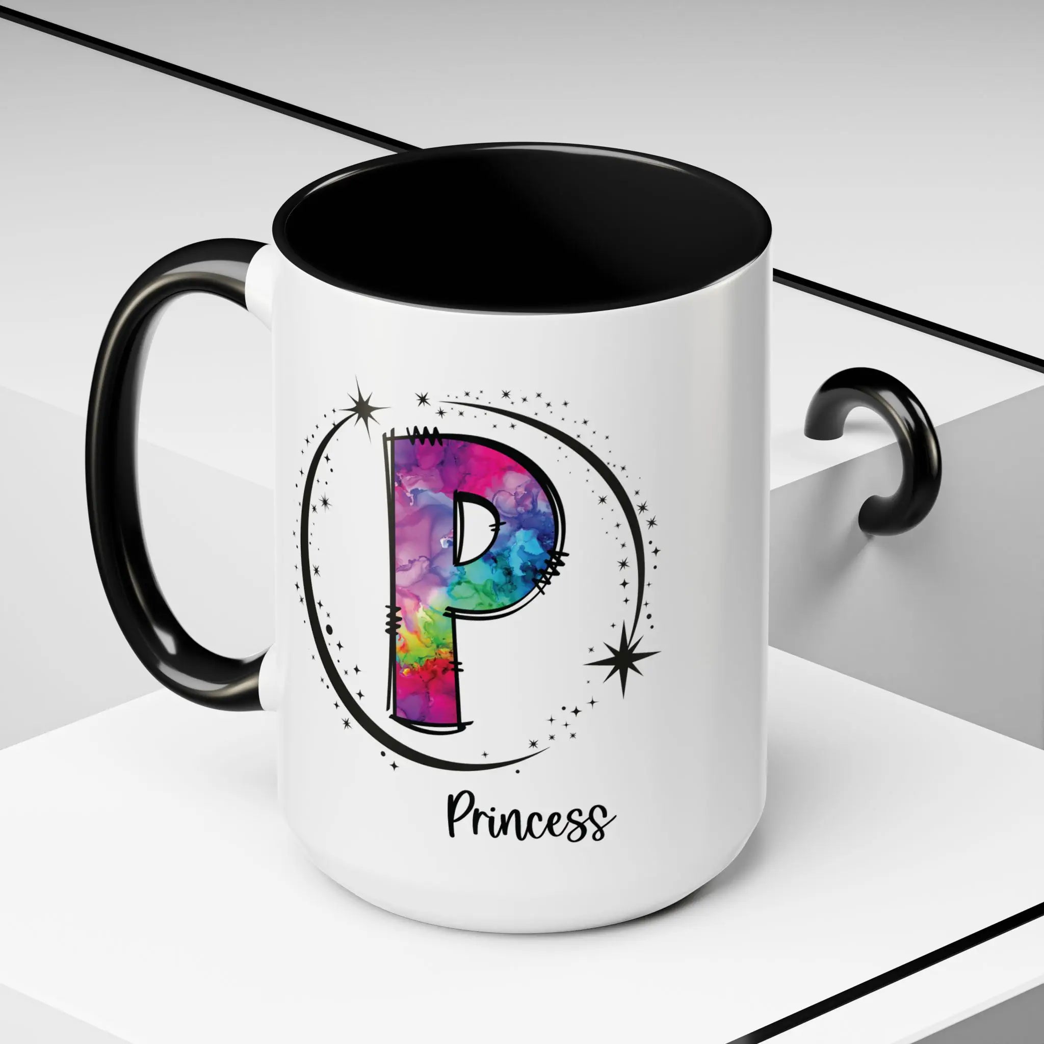 White monogram mug with black handle and interior featuring a colorful letter P design and custom name on decorative background