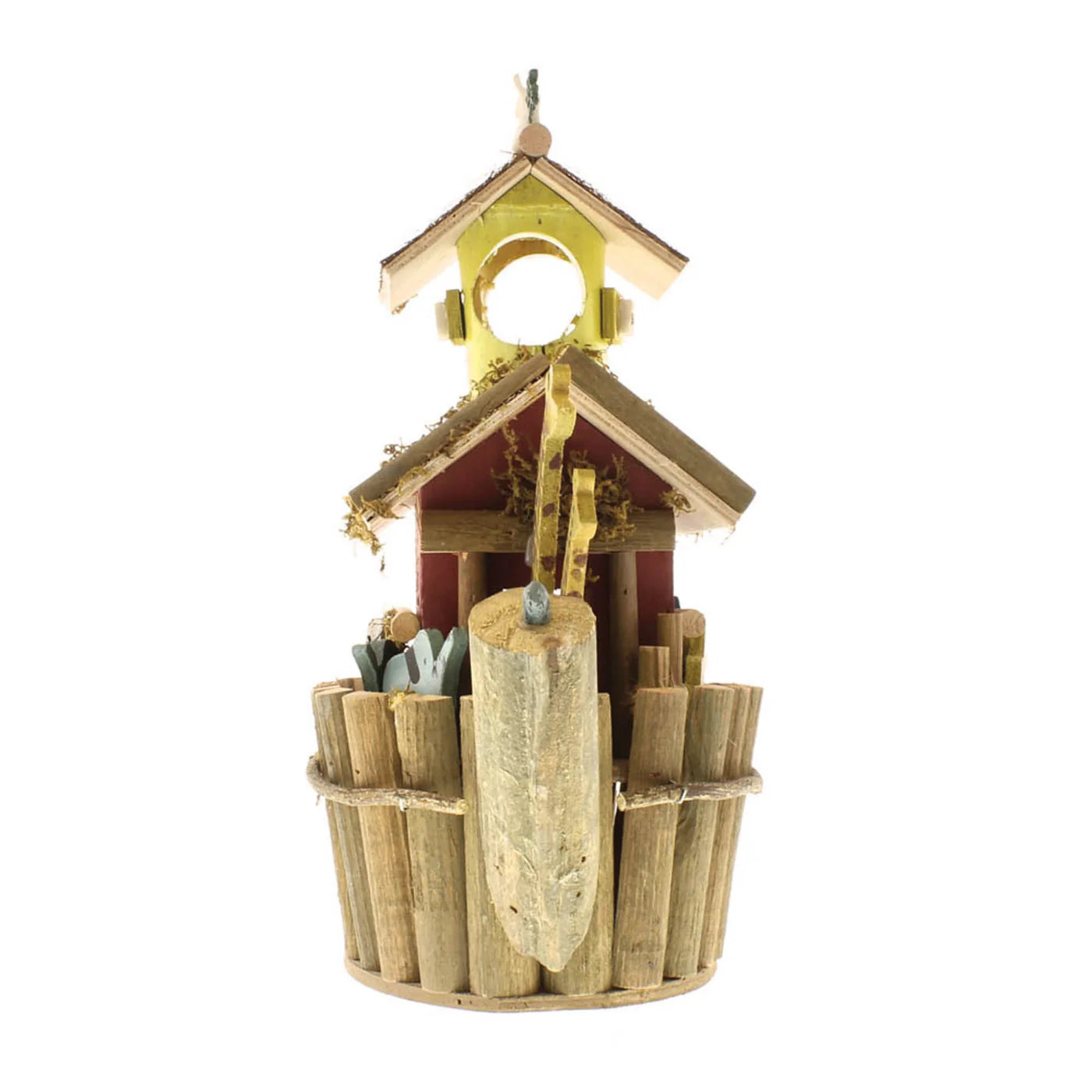 Wooden birdhouse with decorative elements on a table outdoors, front view