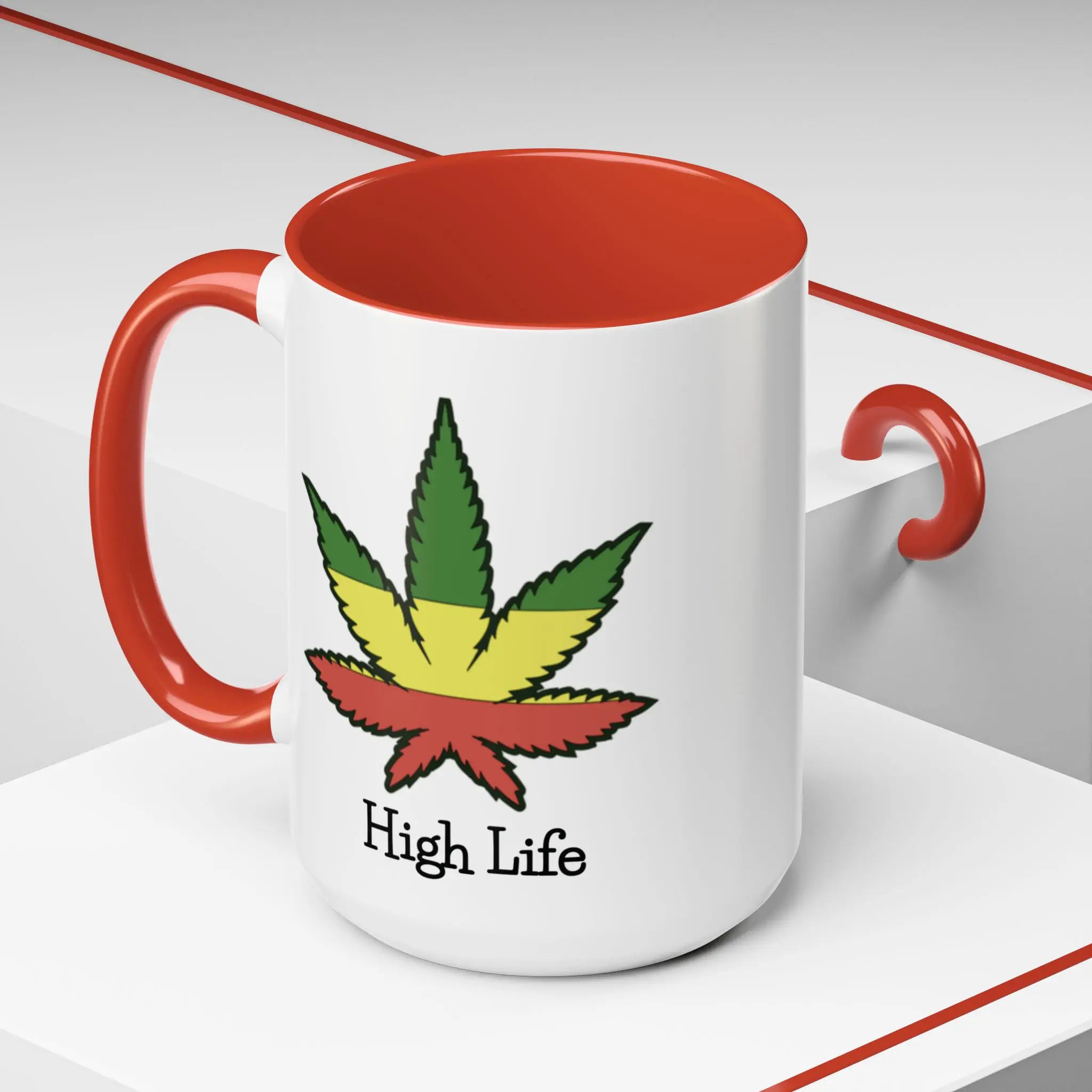 White mug with red interior and handle, featuring a colorful cannabis leaf design and 'High Life' text on a white background.