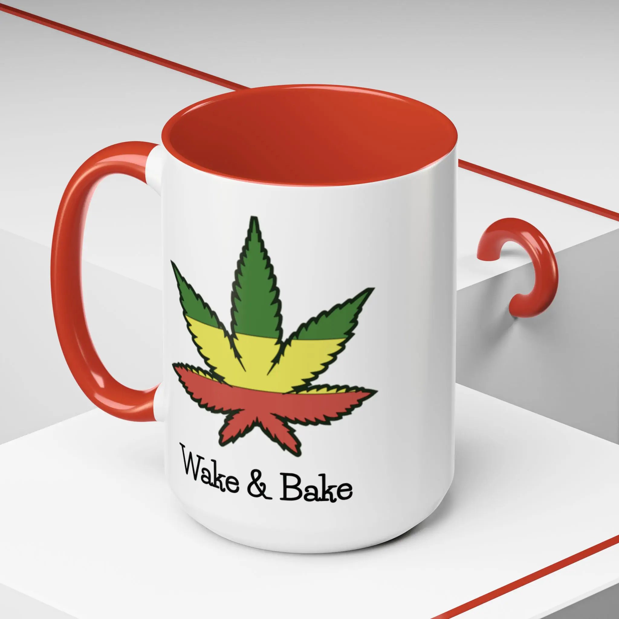 White mug with red interior and handle, featuring a colorful cannabis leaf design and 'Wake & Bake' text.