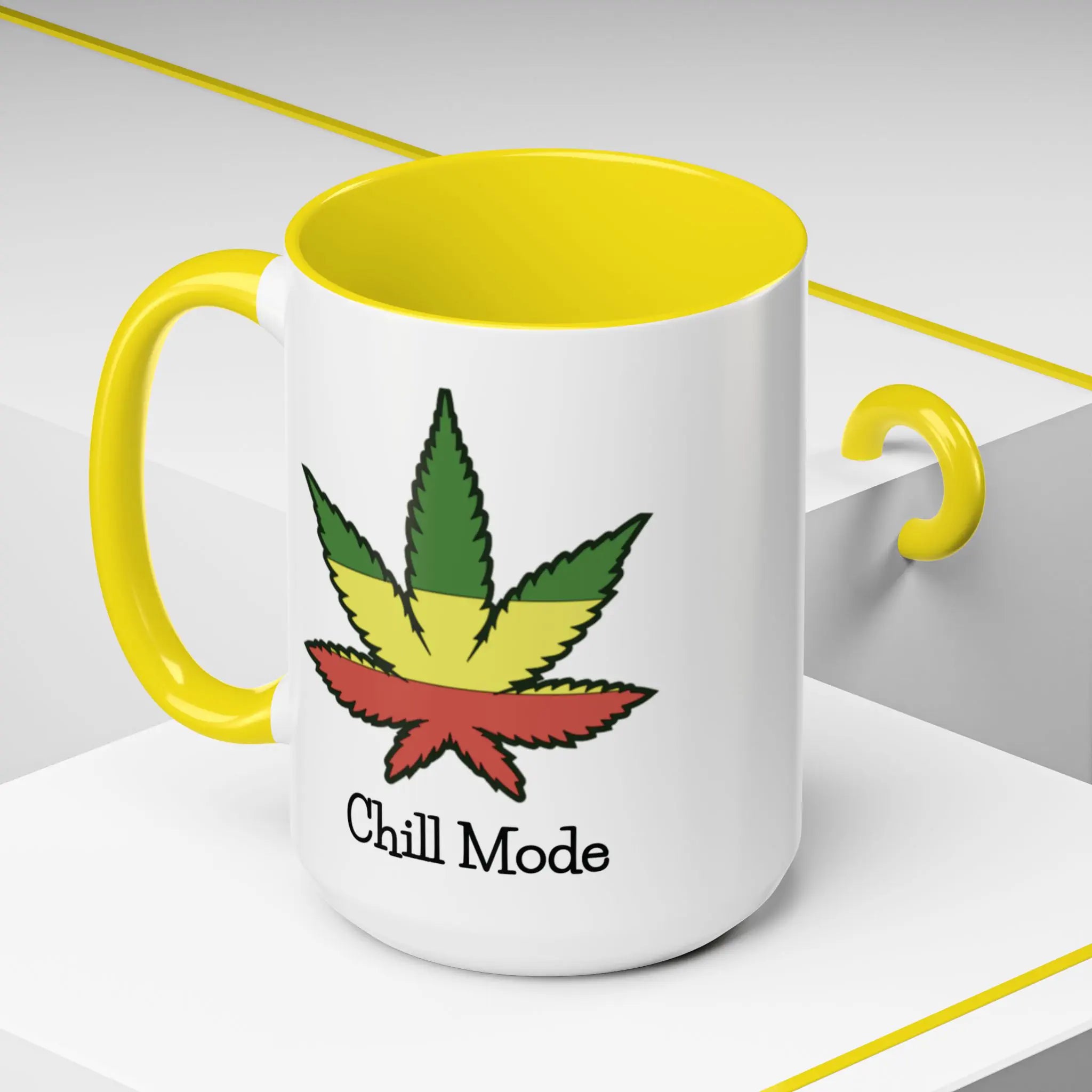 White mug with yellow interior and handle, featuring a colorful cannabis leaf and 'Chill Mode' text.