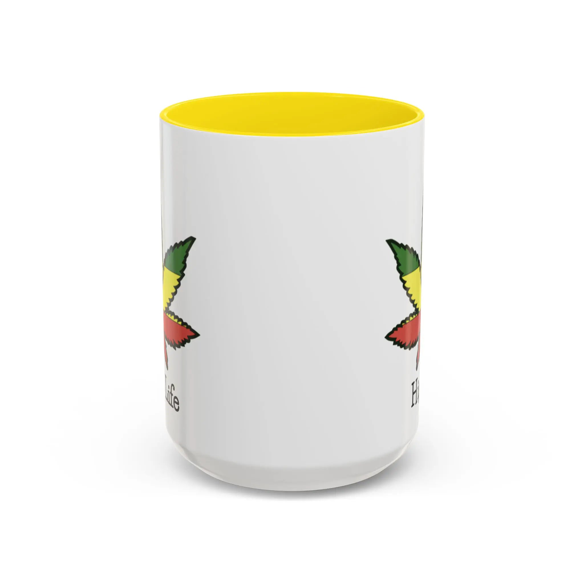 White mug with yellow interior and rasta weed leaf on a white background