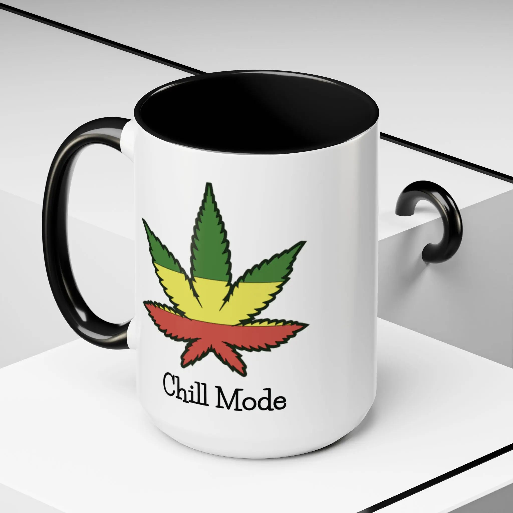 White mug with black interior and handle, featuring a colorful cannabis leaf and 'Chill Mode' text on a white background.
