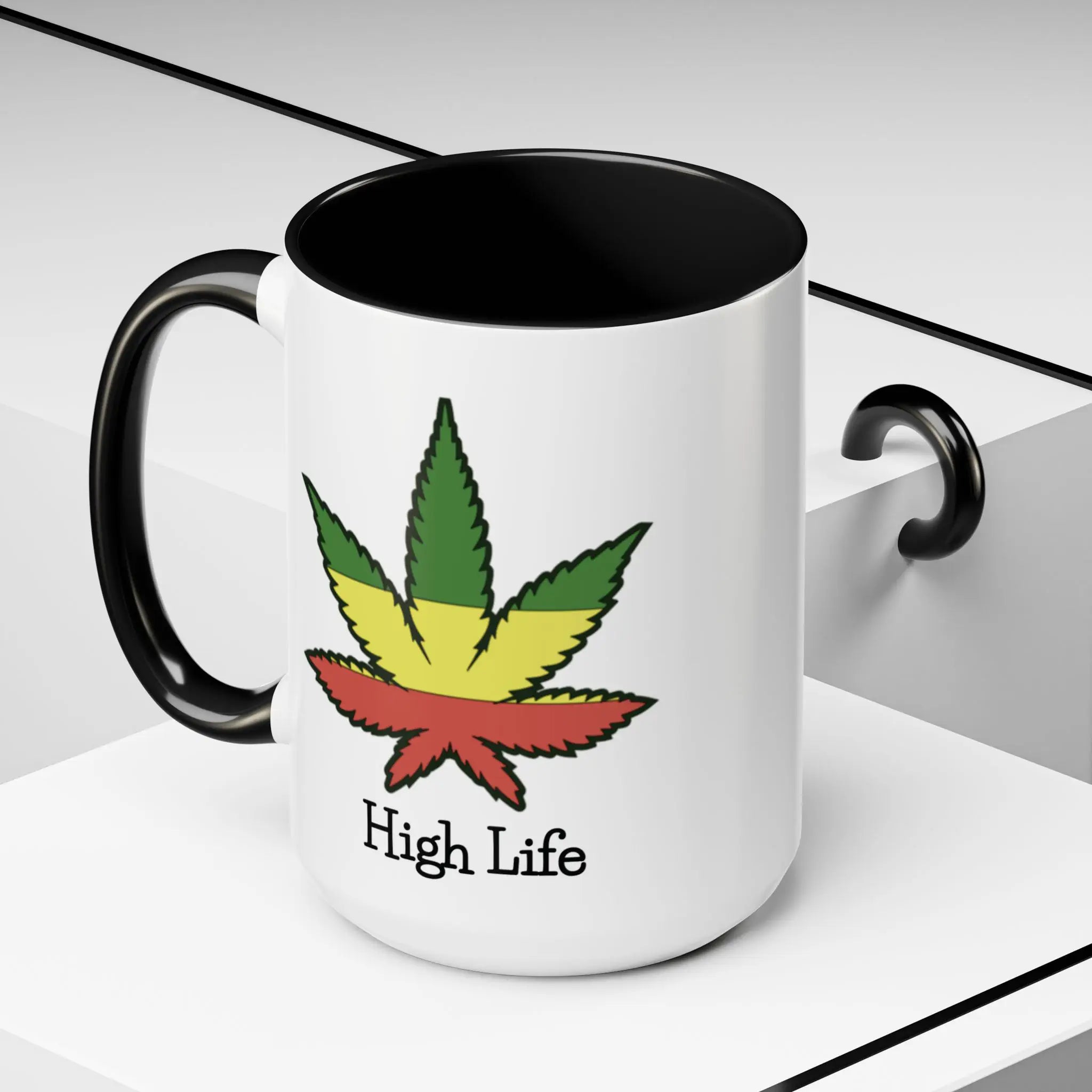White mug with black interior and handles featuring a cannabis leaf design and 'High Life' text on a white background.