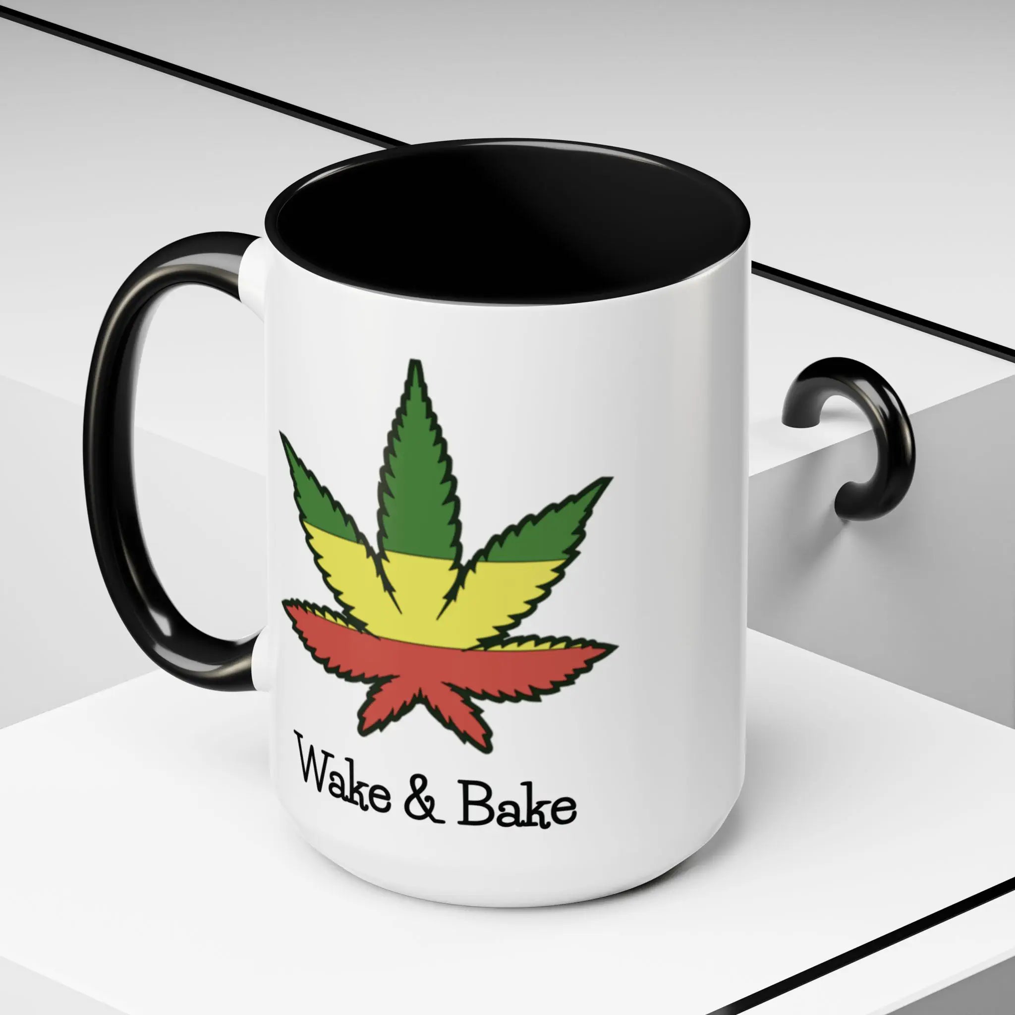 White mug with black interior and handle, featuring a colorful cannabis leaf and 'Wake & Bake' text on a decorative background.