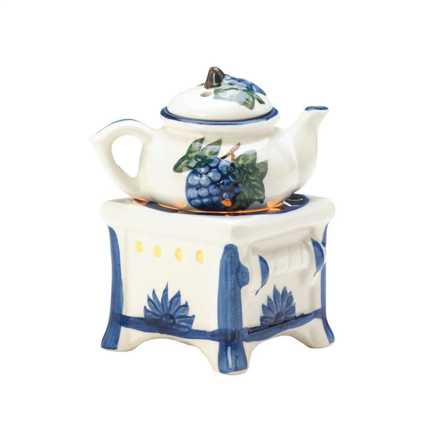 Front view of white teapot oil warmer with blue accents and candlelit stove base